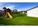 Backyard view of playset and home at 615 E Winter Dr, Phoenix, AZ 85020