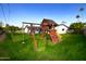 Backyard with playset and grassy area at 615 E Winter Dr, Phoenix, AZ 85020