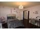 Charming bedroom with a queen bed and stylish decor at 615 E Winter Dr, Phoenix, AZ 85020