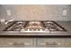 Stainless steel cooktop with five burners and modern design at 615 E Winter Dr, Phoenix, AZ 85020