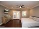 Large bedroom with king bed, private patio access, and dresser at 615 E Winter Dr, Phoenix, AZ 85020