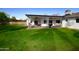 Extended patio, built-in BBQ, and grassy yard at 615 E Winter Dr, Phoenix, AZ 85020