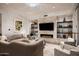 Sophisticated living room with fireplace and built-in shelving at 6311 E Phoenician Blvd # 19, Scottsdale, AZ 85251