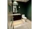 Modern bathroom with dark vanity and updated fixtures at 6587 N Palmeraie Blvd # 2022, Paradise Valley, AZ 85253