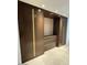 Modern closet with wood and gold accents at 6587 N Palmeraie Blvd # 2022, Paradise Valley, AZ 85253