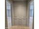 Hallway featuring a built-in storage cabinet with sleek, modern hardware for organized functionality and style at 6587 N Palmeraie Blvd # 2022, Paradise Valley, AZ 85253