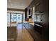 Modern kitchen featuring stainless steel appliances, custom cabinets, and tile flooring at 6587 N Palmeraie Blvd # 2022, Paradise Valley, AZ 85253
