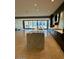 Open concept kitchen with island and access to balcony at 6587 N Palmeraie Blvd # 2022, Paradise Valley, AZ 85253