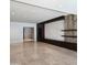 Open-concept living room featuring tile floors, statement wall decor, and recessed lighting at 6587 N Palmeraie Blvd # 2022, Paradise Valley, AZ 85253