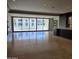 Bright, open living room with sliding glass doors and stylish tile floors at 6587 N Palmeraie Blvd # 2022, Paradise Valley, AZ 85253