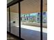 Spacious covered patio with tile floor, offering an outdoor living area with views of lush landscaping at 6587 N Palmeraie Blvd # 2022, Paradise Valley, AZ 85253
