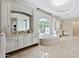 Spa-like bathroom with large soaking tub and double vanity at 6800 E Caballo Dr, Paradise Valley, AZ 85253
