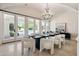 Formal dining room with large windows and pool view at 6800 E Caballo Dr, Paradise Valley, AZ 85253