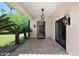 Covered entryway with tiled flooring and elegant light fixtures at 6800 E Caballo Dr, Paradise Valley, AZ 85253
