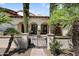 Inviting entryway with decorative iron gate and arched entry at 6800 E Caballo Dr, Paradise Valley, AZ 85253