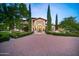 Grand home with a brick driveway and manicured landscaping at 6800 E Caballo Dr, Paradise Valley, AZ 85253