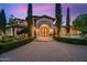 Mediterranean-style home with lush landscaping and brick driveway at 6800 E Caballo Dr, Paradise Valley, AZ 85253
