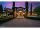 Mediterranean style home with arched entryway and manicured landscaping at 6800 E Caballo Dr, Paradise Valley, AZ 85253