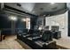 A home theater features comfortable seating and a large screen for an immersive movie experience at 6800 E Caballo Dr, Paradise Valley, AZ 85253
