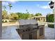 Built-in outdoor kitchen with grill and granite countertop at 6800 E Caballo Dr, Paradise Valley, AZ 85253