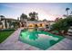 Expansive backyard oasis with a sparkling pool and lush landscaping at 6800 E Caballo Dr, Paradise Valley, AZ 85253