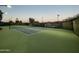 Outdoor tennis court with green surface and city branding at 7751 E Glenrosa Ave # A1, Scottsdale, AZ 85251