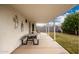 Covered patio with table and chairs, overlooking the backyard at 7819 E Dallas St, Mesa, AZ 85207