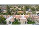 Aerial view of community with numerous homes and landscaping at 7830 E Spanish Oaks Dr, Scottsdale, AZ 85258