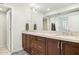 Double vanity bathroom with modern finishes and large mirror at 7830 E Spanish Oaks Dr, Scottsdale, AZ 85258