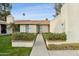 Inviting exterior with well-manicured landscaping and walkway at 7830 E Spanish Oaks Dr, Scottsdale, AZ 85258