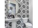 Stylish powder room with patterned tile and pedestal sink at 8716 W Artemisa Ave, Peoria, AZ 85383