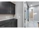 Functional storage room with dark cabinets and shelving at 8716 W Artemisa Ave, Peoria, AZ 85383