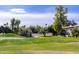 Community with lush green spaces and a golf course at 8829 S 51St St # 3, Phoenix, AZ 85044