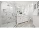 Modern bathroom with a walk-in shower, double vanity, and marble tile at 8829 S 51St St # 3, Phoenix, AZ 85044