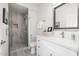 Clean bathroom with a shower, vanity, and stylish mirror at 8829 S 51St St # 3, Phoenix, AZ 85044