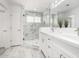 Elegant bathroom featuring a marble shower, double vanity, and modern fixtures at 8829 S 51St St # 3, Phoenix, AZ 85044