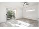 Bright bedroom with sliding door to balcony, ceiling fan and carpet at 8829 S 51St St # 3, Phoenix, AZ 85044