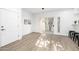 Light-filled dining area with hardwood floors and sliding glass door to patio at 8829 S 51St St # 3, Phoenix, AZ 85044