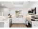 Modern white kitchen with stainless appliances at 8829 S 51St St # 3, Phoenix, AZ 85044