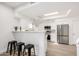 Modern kitchen with breakfast bar and stainless steel appliances at 8829 S 51St St # 3, Phoenix, AZ 85044