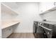 Laundry room with washer, dryer, shelving, and countertop at 8829 S 51St St # 3, Phoenix, AZ 85044