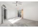 Spacious main bedroom with ceiling fan and private balcony access at 8829 S 51St St # 3, Phoenix, AZ 85044