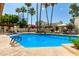 Refreshing community pool with lounge chairs and patio at 8829 S 51St St # 3, Phoenix, AZ 85044