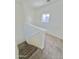 Upstairs hallway with carpeting and access to bedrooms at 9072 N 47Th Ln, Glendale, AZ 85302