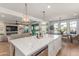 Open kitchen with marble countertops and custom cabinetry at 9654 W Weeping Willow Rd, Peoria, AZ 85383