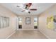 Charming bedroom with ceiling fan and two windows at 10012 W Sandstone Dr, Sun City, AZ 85351