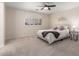 Spacious bedroom with carpeted floor and large window at 10035 E Diamond Dr, Sun Lakes, AZ 85248