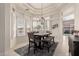 Casual dining area with table, bench seating, and large windows at 10035 E Diamond Dr, Sun Lakes, AZ 85248