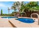 Lush backyard with a refreshing pool and spa at 10035 E Diamond Dr, Sun Lakes, AZ 85248