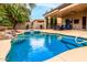 Relaxing pool area with a spa and covered patio at 10035 E Diamond Dr, Sun Lakes, AZ 85248